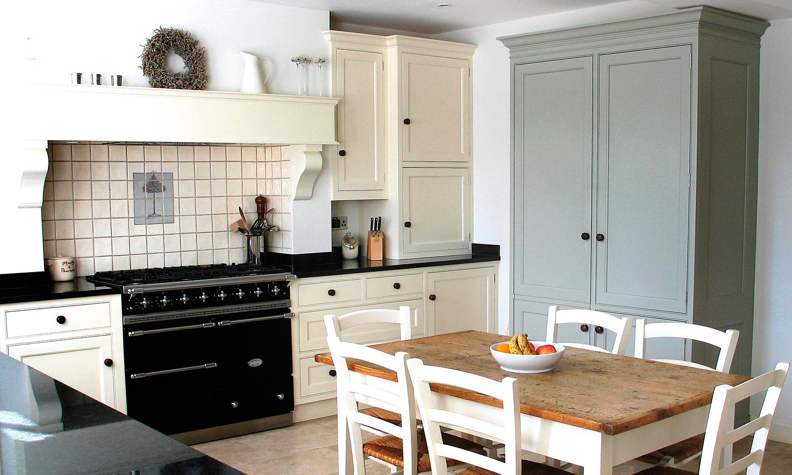 Otford. A classic handmade, hand-painted, Shaker style kitchen, installed in a traditional farmhouse and featuring a built in Bang & Olufsen music system. A bespoke hand-crafted kitchen manufactured by the skilled cabinet makers at Mounts Hill Woodcraft.