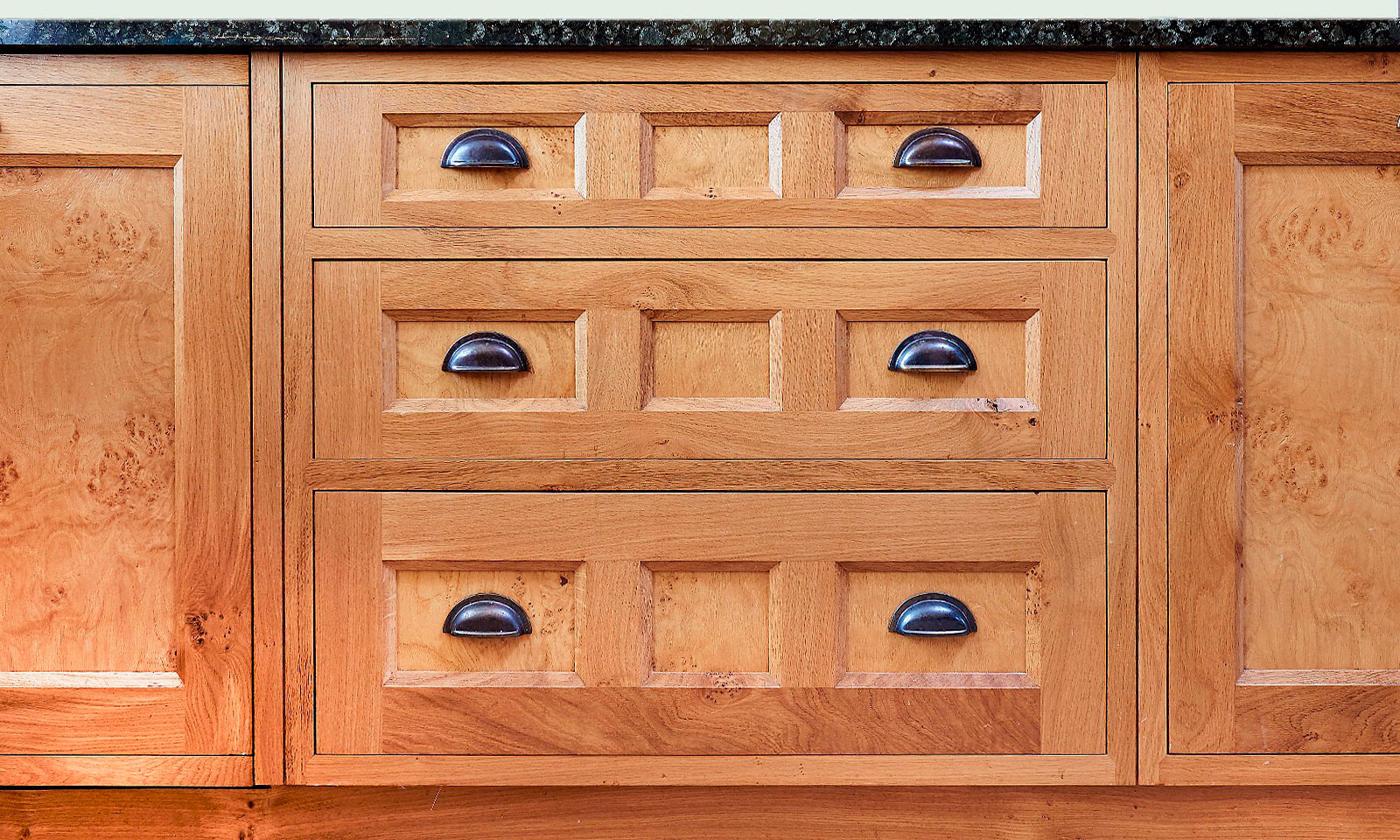 Pantiles. A classic handmade, hand-painted, Shaker style kitchen, installed in a grade II listed building. Built using solid European oak and finished in cluster oak veneer with granite worktops. Another hand-crafted kitchen manufactured by the skilled cabinet makers at Mounts Hill Woodcraft.