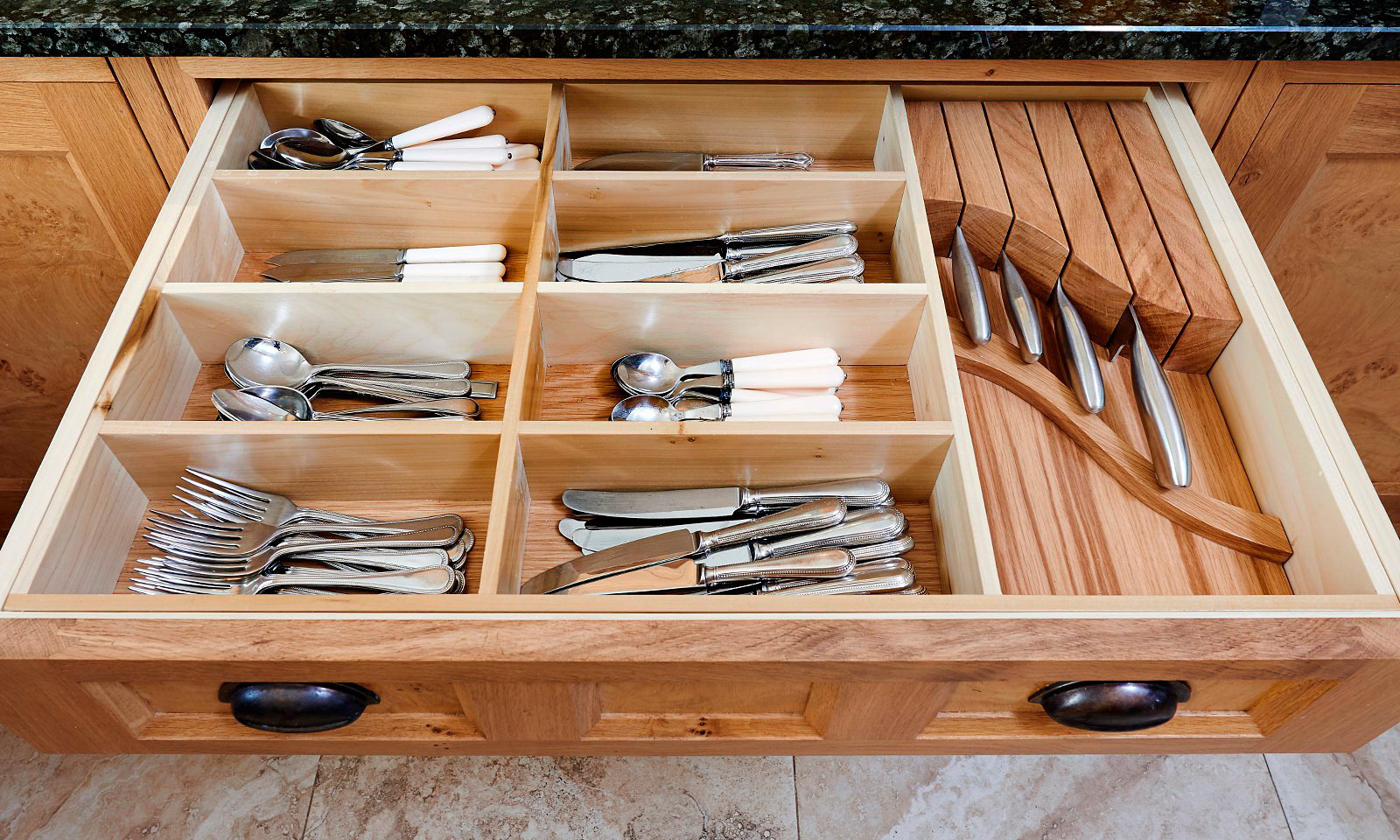 Pantiles. A classic handmade, hand-painted, Shaker style kitchen, installed in a grade II listed building. Built using solid European oak and finished in cluster oak veneer with granite worktops. Another hand-crafted kitchen manufactured by the skilled cabinet makers at Mounts Hill Woodcraft.